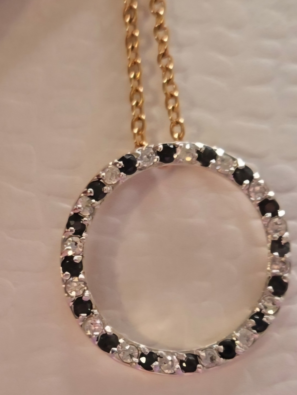 Gold-Tone Circle Pendant Necklace with Deep Blue Sapphire and Clear Stones